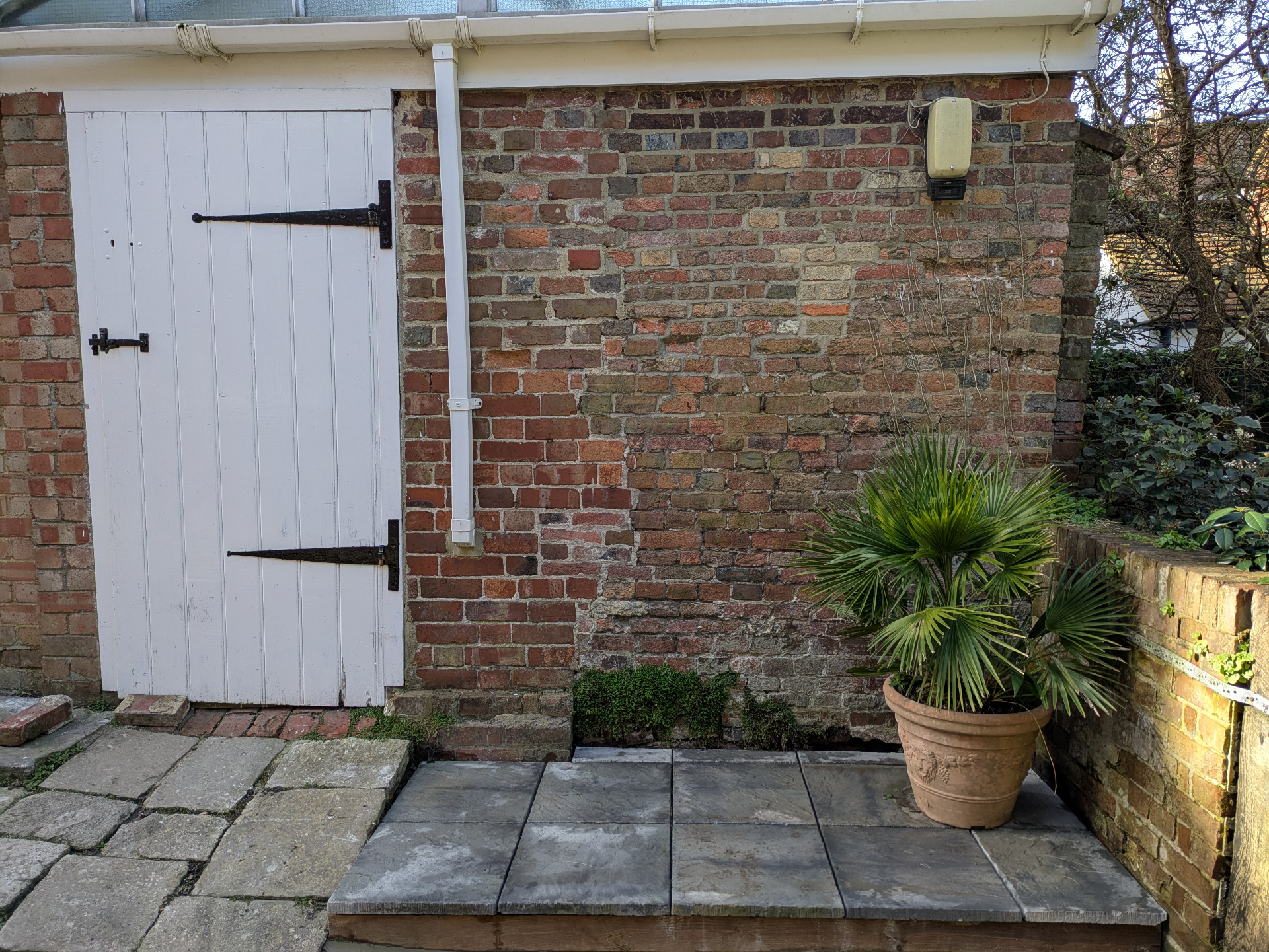 Brick wall and patio landscaping
